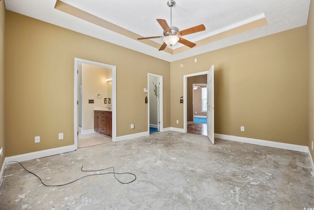 197 Black Bear Rd, Myrtle Beach, SC 29588 - unfurnished bedroom with a tray ceiling, concrete floors, ornamental molding, and ensuite bathroom