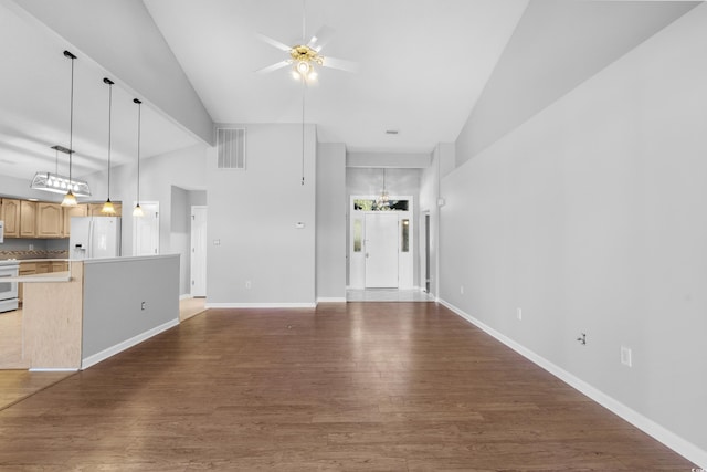 unfurnished living room featuring wood finished floors, visible vents, baseboards, and ceiling fan with notable chandelier