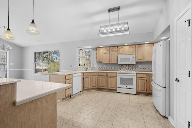 kitchen with white appliances, pendant lighting, light countertops, and light brown cabinetry