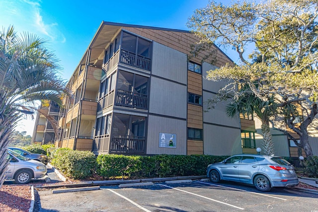 view of property with uncovered parking