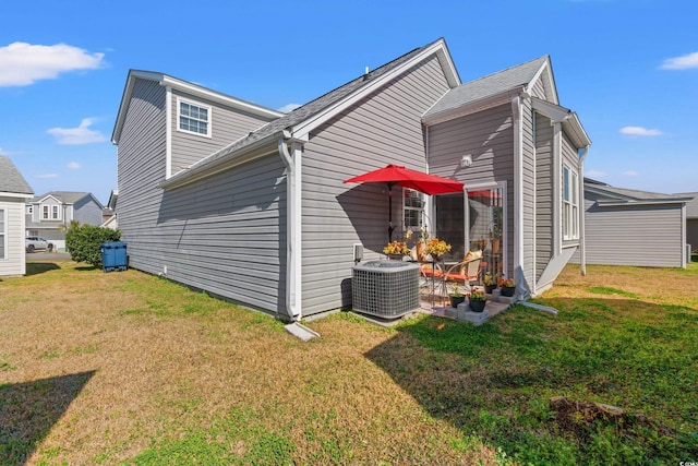 view of home's exterior with central AC and a lawn