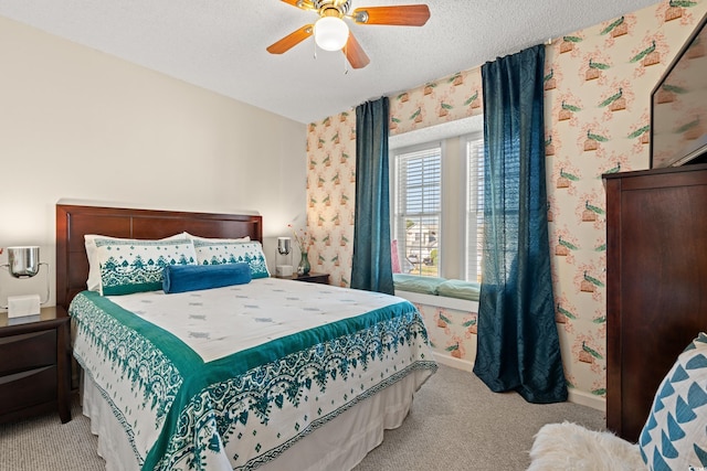 bedroom featuring a textured ceiling, baseboards, light colored carpet, and wallpapered walls