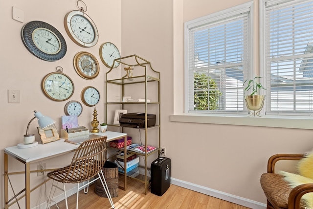 office space featuring light wood finished floors and baseboards