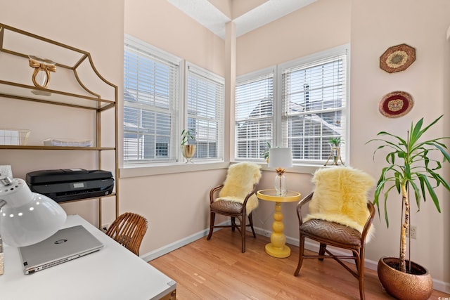 office space featuring light wood finished floors and baseboards