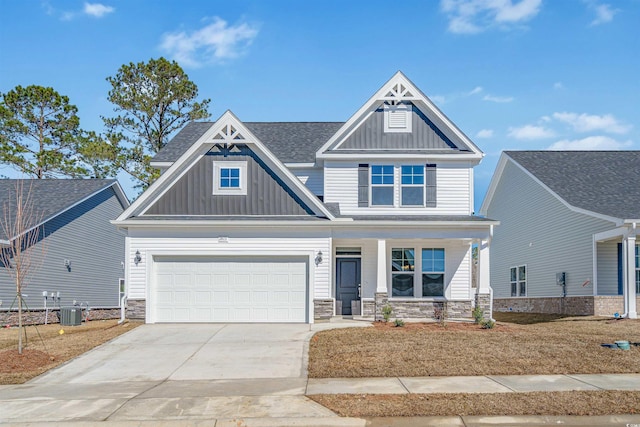 craftsman house featuring stone siding, central AC unit, a porch, and board and batten siding