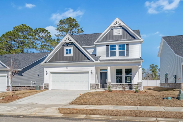 craftsman house featuring a porch, a garage, stone siding, concrete driveway, and board and batten siding