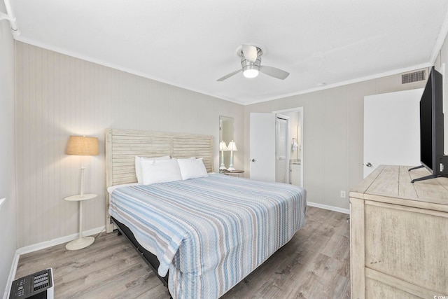 900 N Waccamaw Dr Unit 303, Murrells Inlet, SC 29576 - bedroom with wood finished floors, ornamental molding, a ceiling fan, and ensuite bath