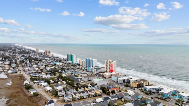 drone / aerial view with a water view, a view of city, and a view of the beach