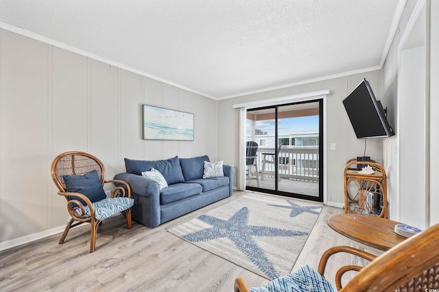 900 N Waccamaw Dr Unit 303, Murrells Inlet, SC 29576 - living area with wood finished floors, ornamental molding, and a textured ceiling