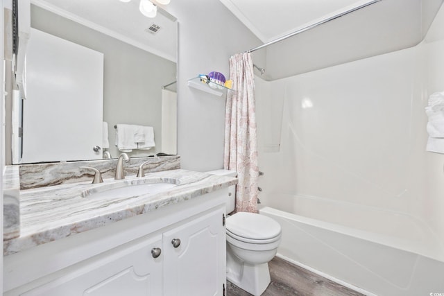 full bathroom featuring crown molding, visible vents, toilet, vanity, and wood finished floors