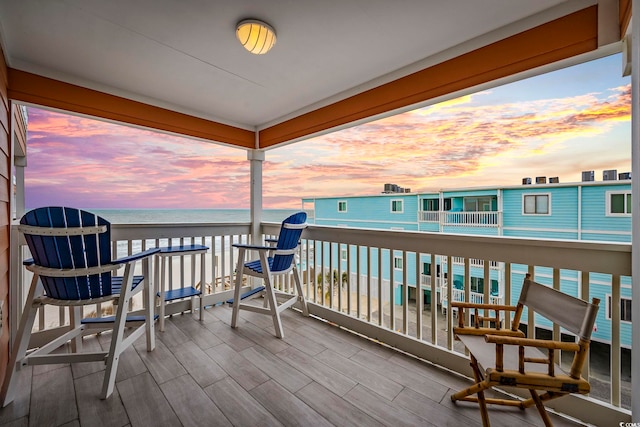 wooden deck with a water view