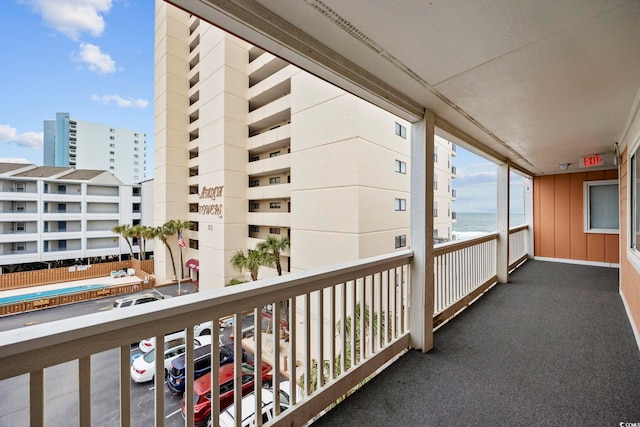 balcony with a view of city and a water view