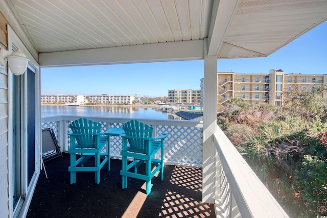 balcony featuring a water view