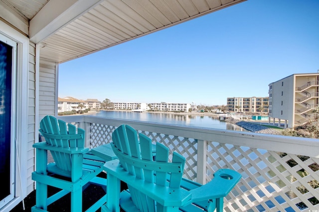 balcony featuring a water view