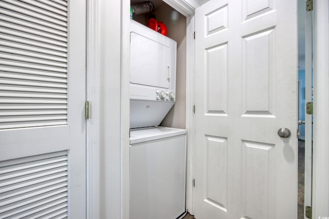 laundry room featuring laundry area and stacked washer and clothes dryer