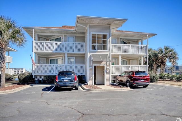 view of property with uncovered parking