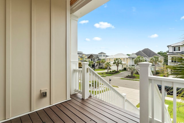 wooden deck with a residential view