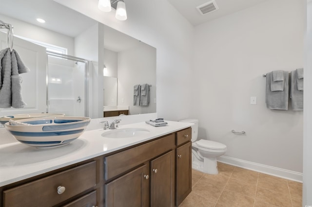 bathroom featuring visible vents, baseboards, a stall shower, tile patterned floors, and vanity