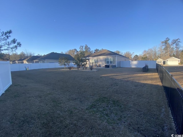 view of yard with a fenced backyard