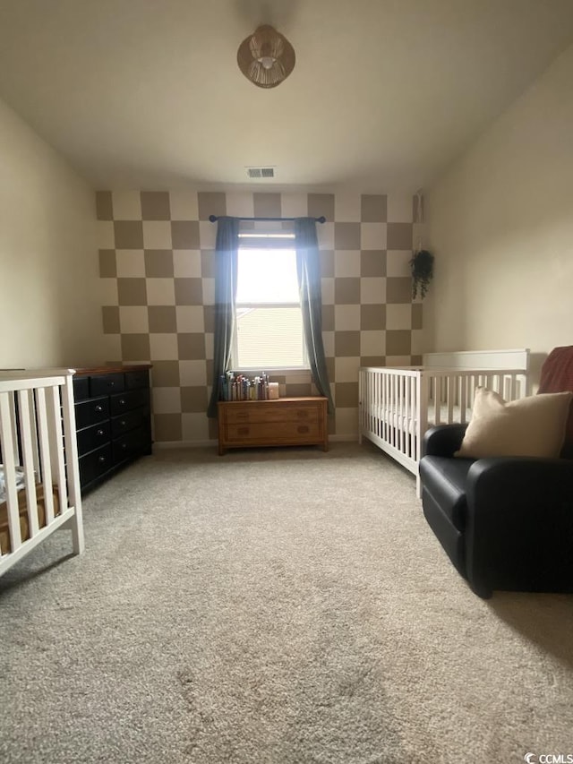 unfurnished bedroom featuring wallpapered walls, baseboards, visible vents, and carpet flooring