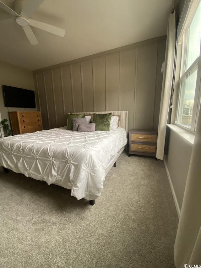 bedroom featuring ceiling fan, baseboards, and carpet flooring