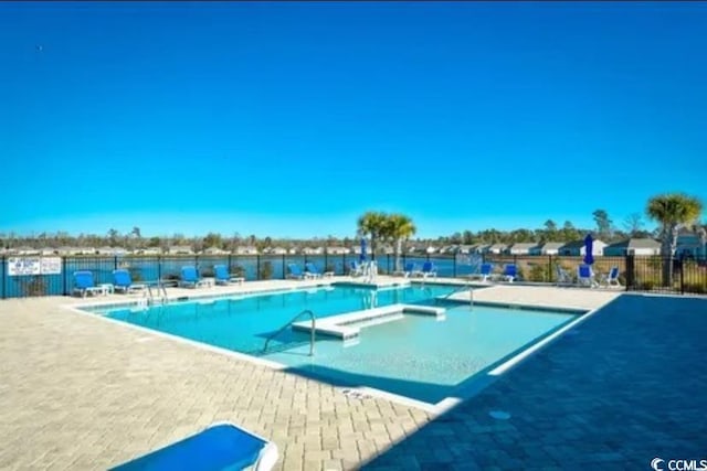 pool featuring a patio and fence