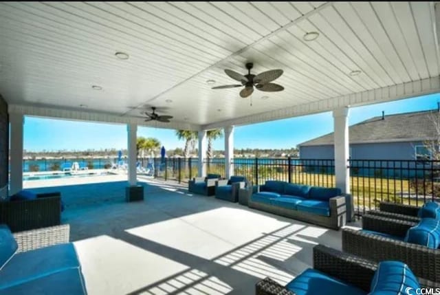 view of patio featuring an outdoor hangout area, ceiling fan, and fence