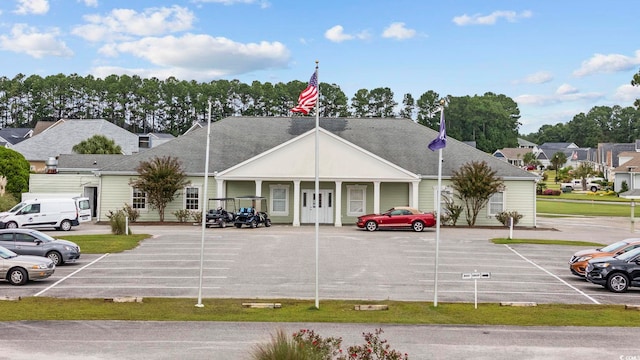 view of building exterior featuring uncovered parking