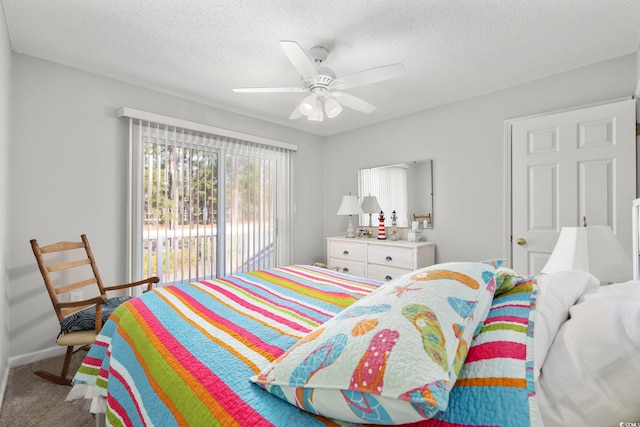 carpeted bedroom with access to exterior, ceiling fan, baseboards, and a textured ceiling