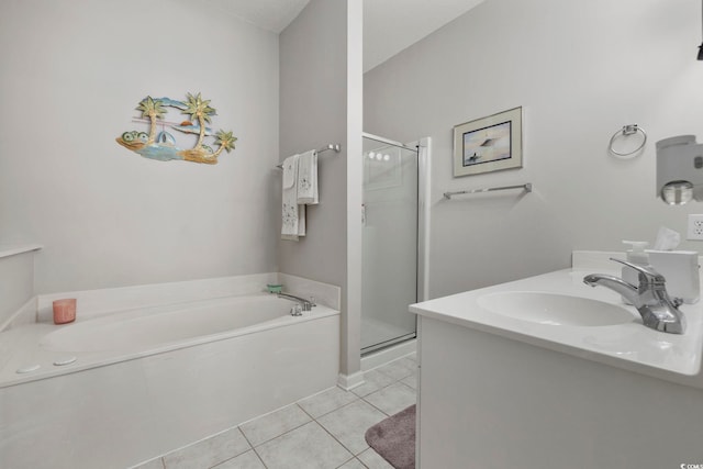 bathroom featuring a stall shower, a sink, a bath, and tile patterned floors