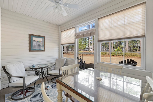 sunroom / solarium with a ceiling fan