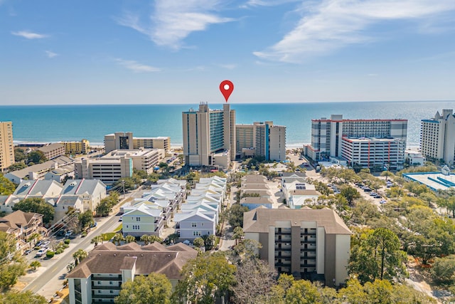 birds eye view of property with a view of city and a water view