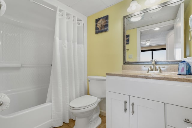 bathroom featuring shower / tub combo with curtain, vanity, toilet, and tile patterned floors