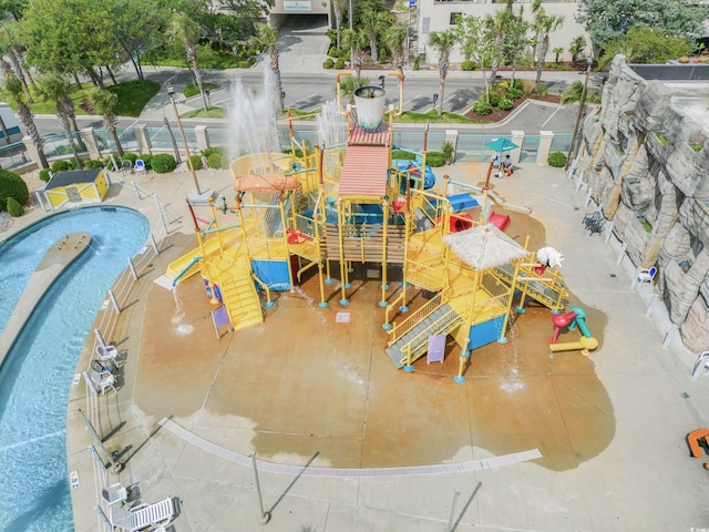 view of swimming pool featuring a water play area