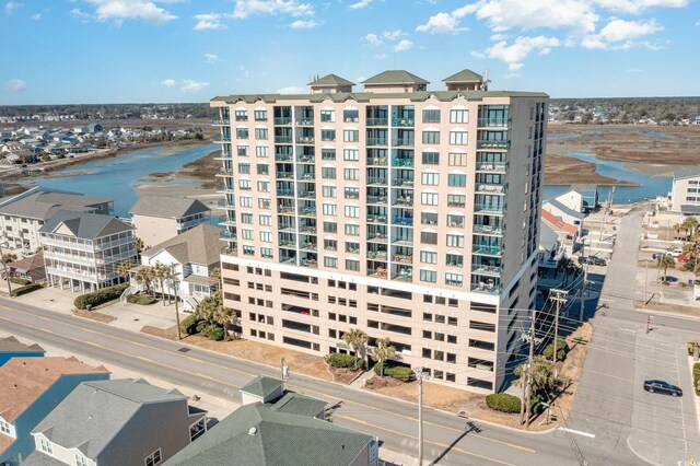 view of building exterior with a water view