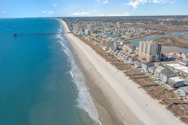 birds eye view of property featuring a city view, a beach view, and a water view