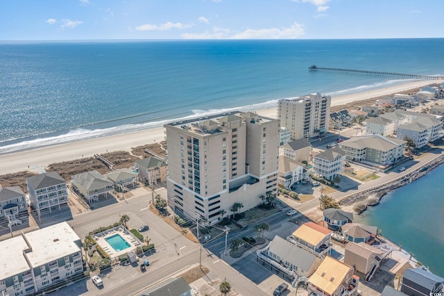 bird's eye view with a water view and a view of the beach