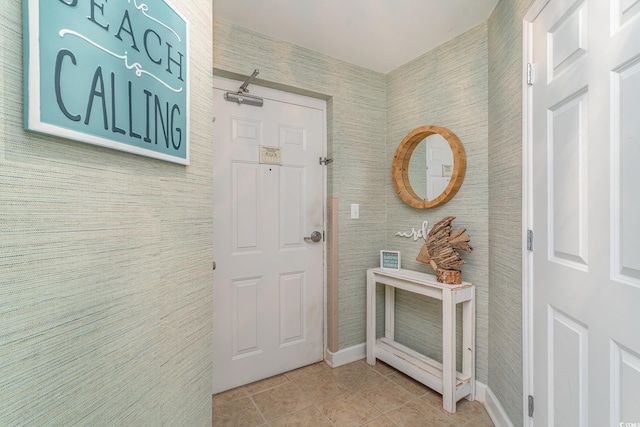 doorway featuring light tile patterned flooring