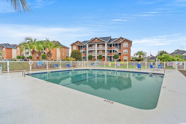 pool featuring a residential view and fence