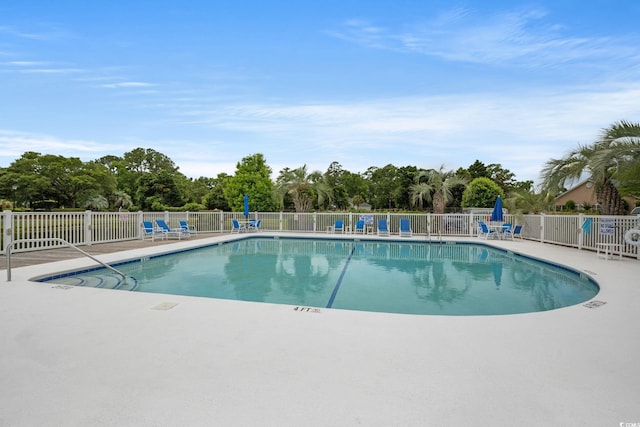 community pool featuring fence