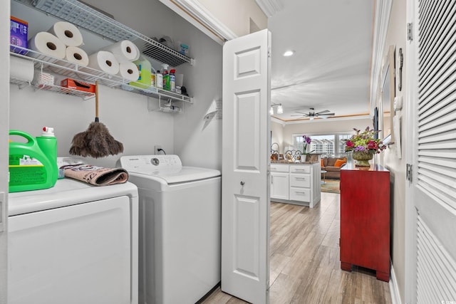 clothes washing area with a ceiling fan, light wood-type flooring, laundry area, and separate washer and dryer