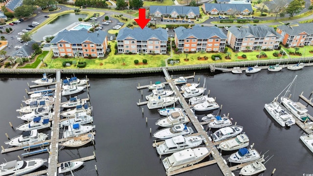 bird's eye view with a water view and a residential view