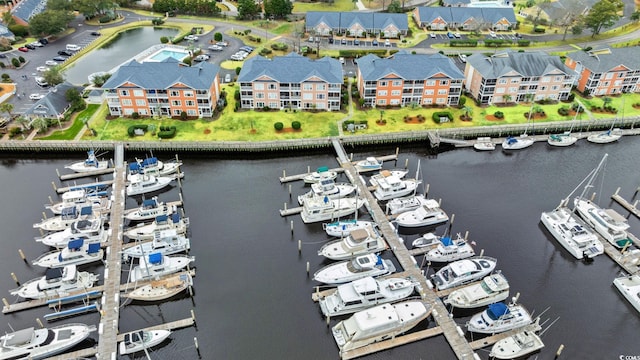 bird's eye view with a water view and a residential view