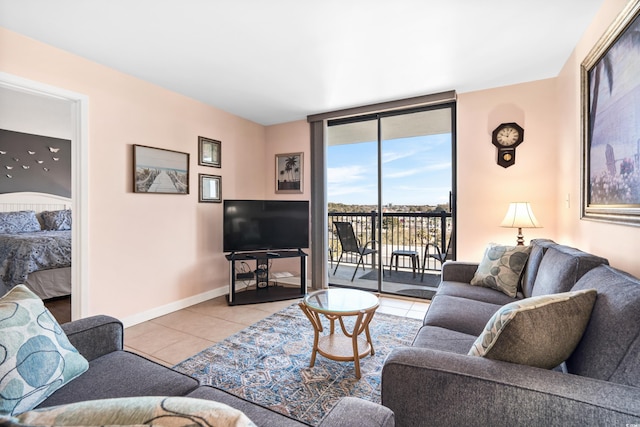 living room with a wall of windows, baseboards, and light tile patterned floors