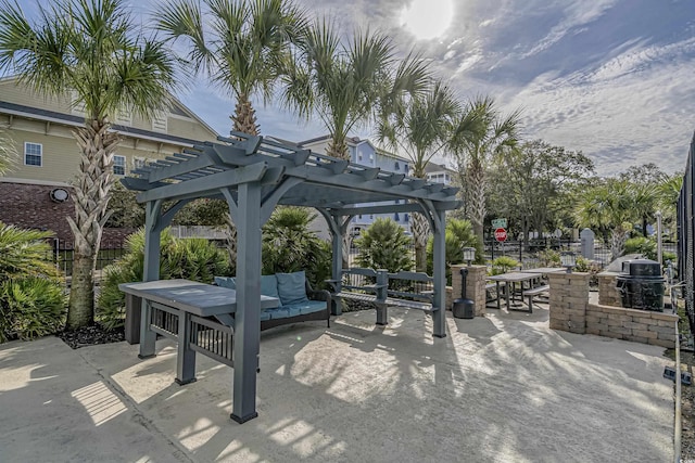 view of property's community with an outdoor hangout area, fence, a pergola, outdoor dining space, and a patio area