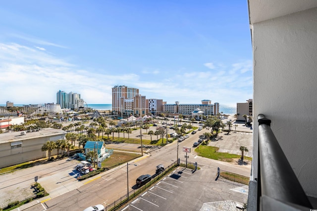 exterior space with a city view and a water view