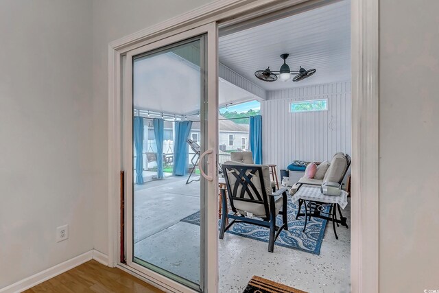 interior space featuring ceiling fan and baseboards