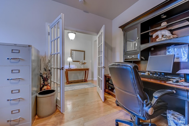 office area featuring light wood-type flooring and french doors