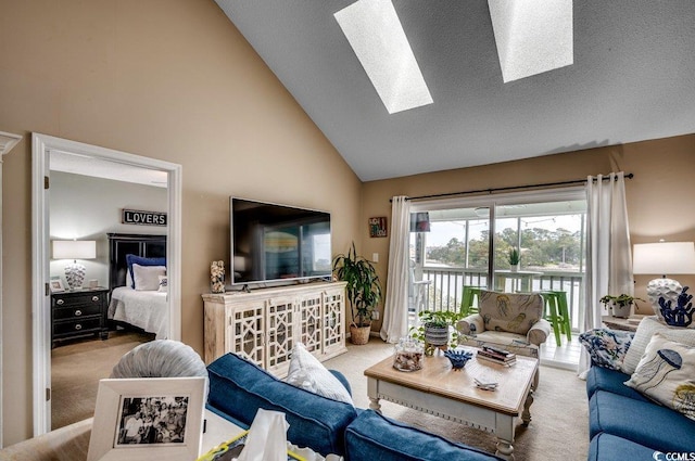 carpeted living area featuring a textured ceiling, high vaulted ceiling, and a skylight