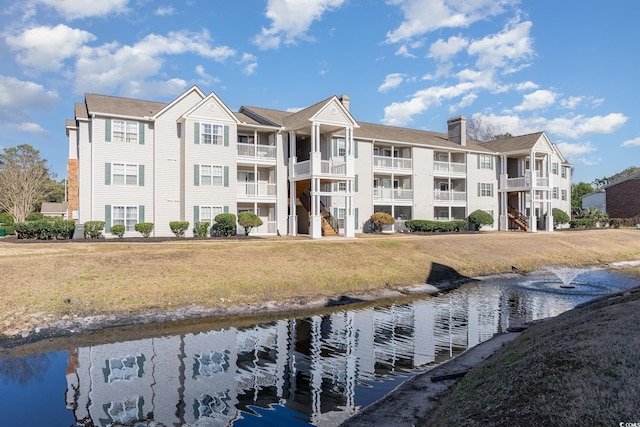 view of building exterior featuring a water view